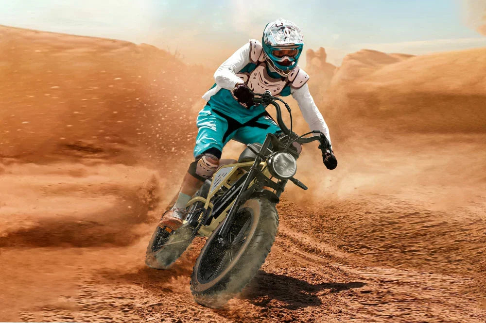 JANSNO X70 vintage dirt-style electric bike drifting on sandy desert off-road terrain.